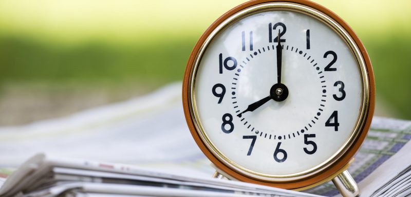 Time management - retro red alarm clock